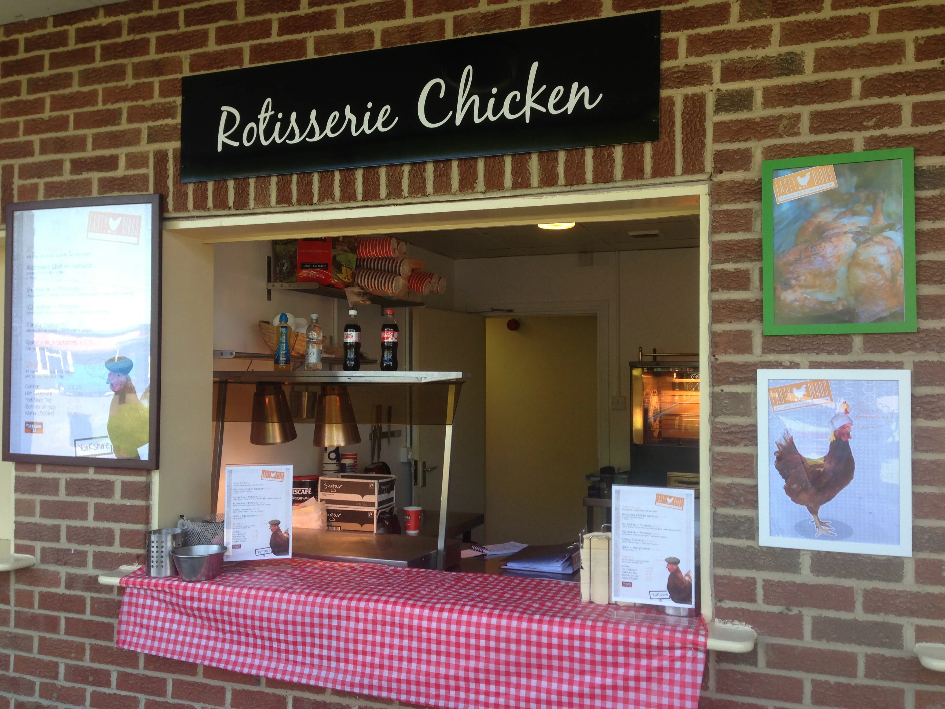 The Tastybirds rotisserie chicken counter at a venue